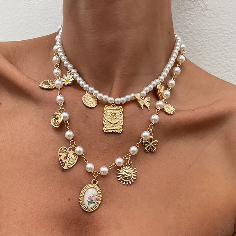 Collar de lujo Glow con colgantes de mariposa, girasol y corazón, perlas de imitación, diseño elegante para mujer.