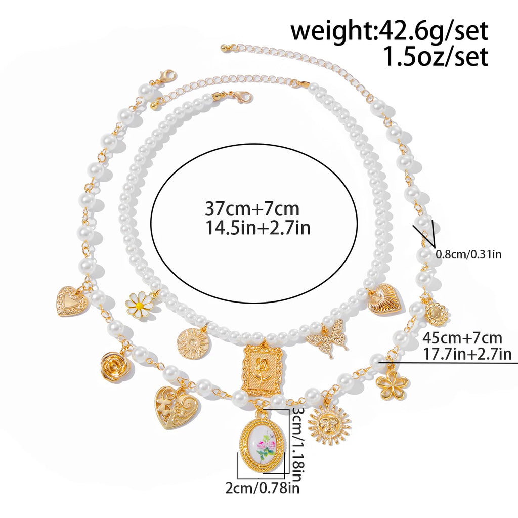 Collar de lujo Glow con colgantes de mariposa, girasol y corazón, perlas de imitación, para mujer, set de 2 unidades.