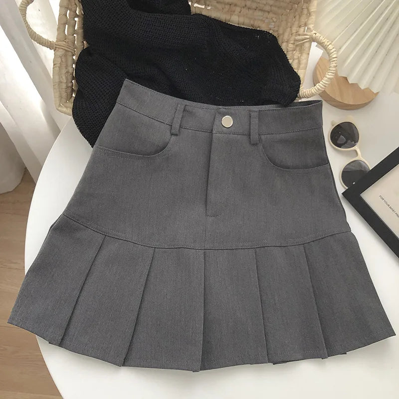 Falda plisada vintage Y2K de cintura alta con estilo universitario, de la marca Glow, en color negro, para mujer.