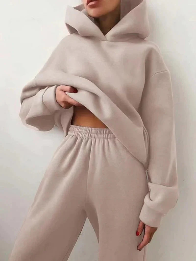 Conjunto de chándal de dos piezas de la marca ANZ, sudadera y pantalones deportivos en color gris, para ejercicio y comodidad.