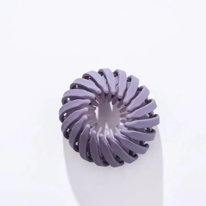 Pasador de cabello en forma de nido de pájaro de la marca ANZ, para recoger el cabello en un peinado tipo ponytail.
